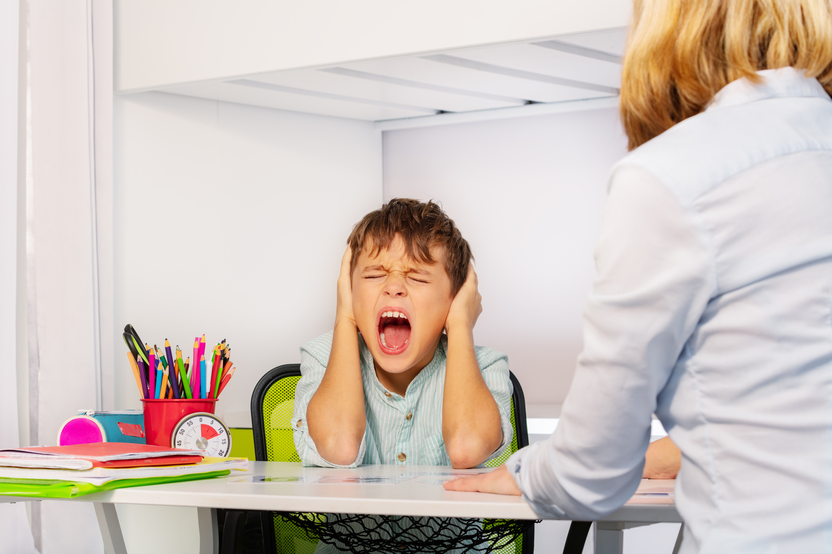 Boy with Autism Disorder Screaming in front of Teacher 