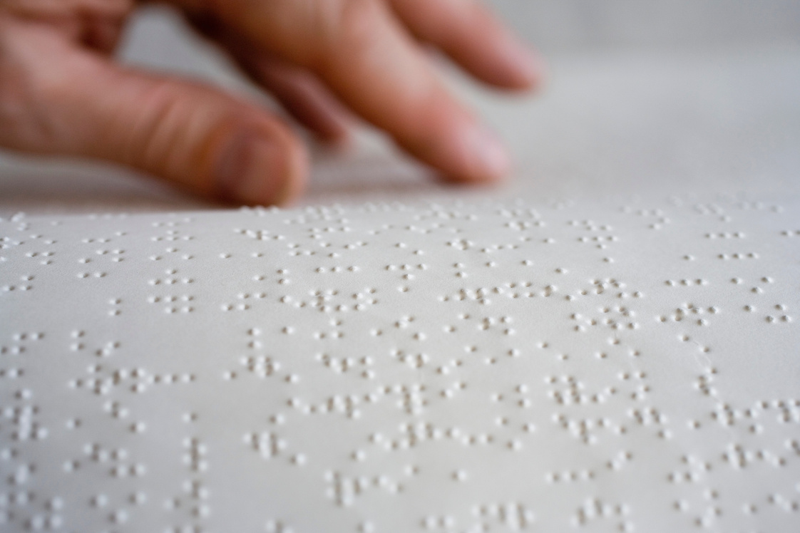 Hand reading braille