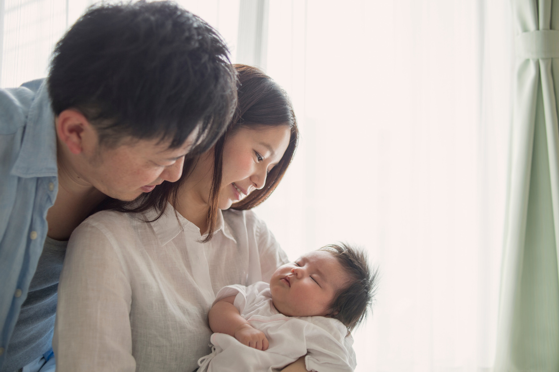 Happy family with newborn baby